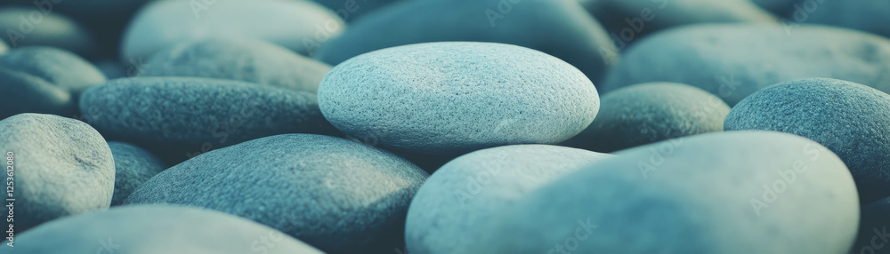 Poster smooth stones with varied textures and rounded edges against a grunge background