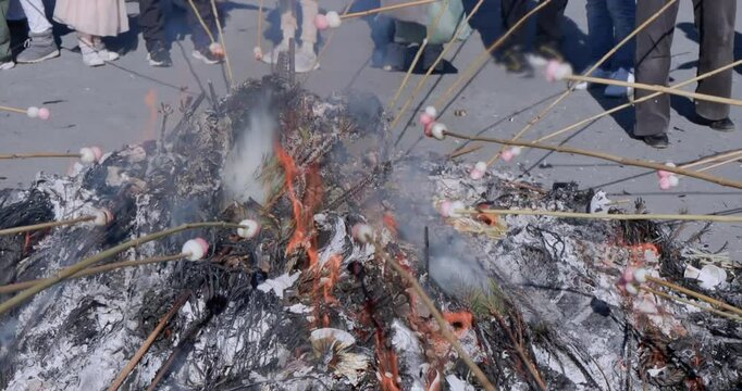 Dontoyaki, where dumplings are roasted over the flames of burning New Year's decorations