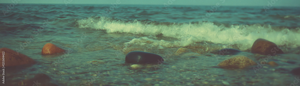 Aufkleber halftone texture of pebbles along the serene beach with gentle waves and varied sizes