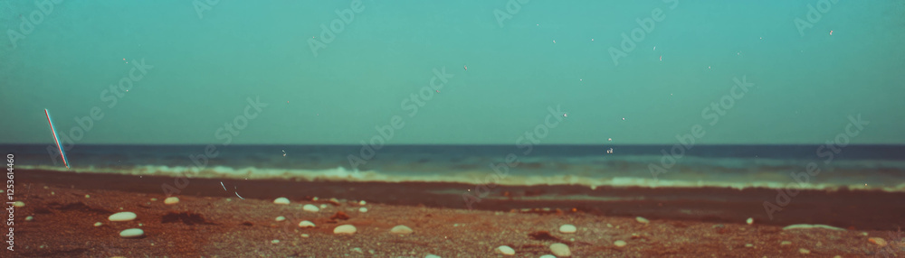 Aufkleber halftone texture of diverse pebbles on a serene beach under a bright sky