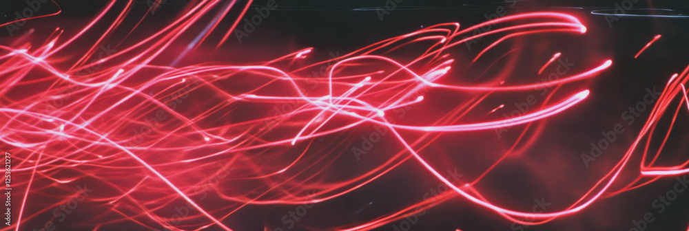 Poster Swirling red sparks create dynamic movement in a vibrant display of light energy