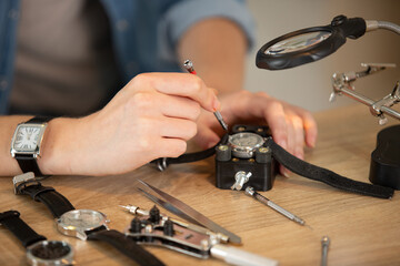 pocket watch being repaired by watch maker