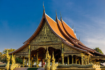Background of the tourist attraction Wat Sirindhorn Wararam or the famous glowing temple in...