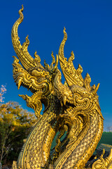 Background of the tourist attraction Wat Sirindhorn Wararam or the famous glowing temple in Thailand. Ubon Ratchathani is adjacent to Laos. Tourists always like to come to see the beauty at night.