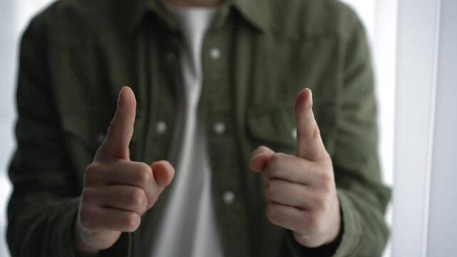 A man shows the size with his hands.
A man demonstrates size with his hands.
Very small.
Very big.
Hand gesture.
Size, centimeters, millimeters, thickness, length