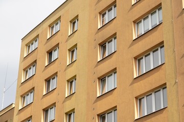 Fototapeta premium Reconstructed facade on orange block of flats in Havirov