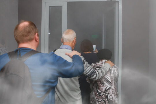 people are evacuated from the burning building