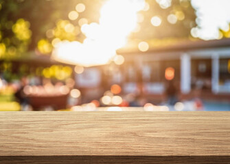 summer time party in backyard garden with grill BBQ, wooden table, blurred background