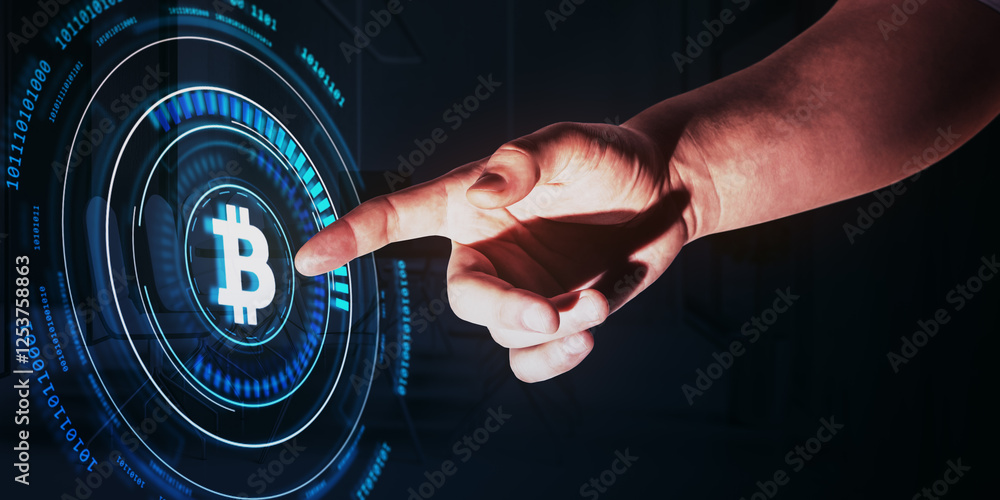 Leinwandbilder hand pointing at glowing bitcoin icon with virtual digital interface on dark background.
