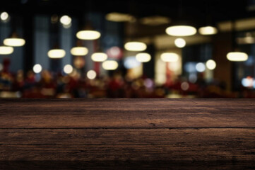Natural wooden counter top with empty space or product mockup. restaurant counter. Blur interior of cafe, Coffee shop or restaraunt. Products display cafe or bar. product placement