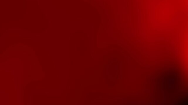 A blurred red background with abstract shapes and gradients.