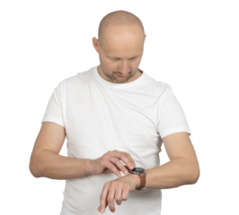 Man in a white t-shirt checking the time on his smartwatch