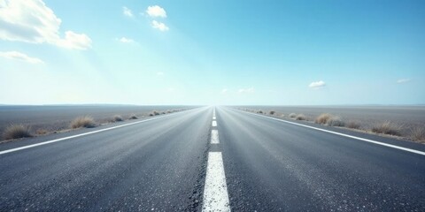 Fototapeta premium A Long Straight Asphalt Road Under a Bright Sunny Sky with Light Clouds and Sparse Vegetation on Either Side, Leading Towards a Distant Horizon