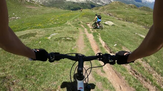 Two Mountain Bikers Climbing the Trail from Riale to Gries Pass, Val Formazza, Italian Alps