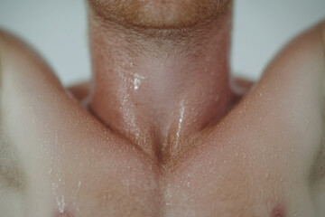 A man with a wet neck and a beard