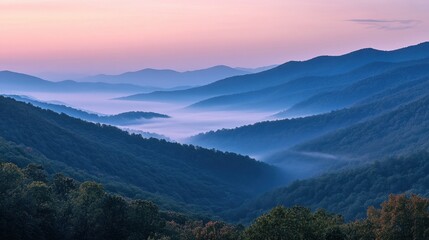 A breathtaking serene mountain range covered in mist during dawn, showcasing the tranquility and pristine nature of the landscape with soft light and shadows.