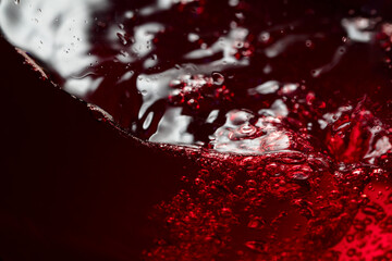 Red wine abstract splashing in glass.