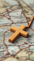Naklejka premium Wooden Cross on Antique Map Journey