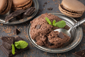 Chocolate mocha mousse with sweet macaron macaroon cookies.