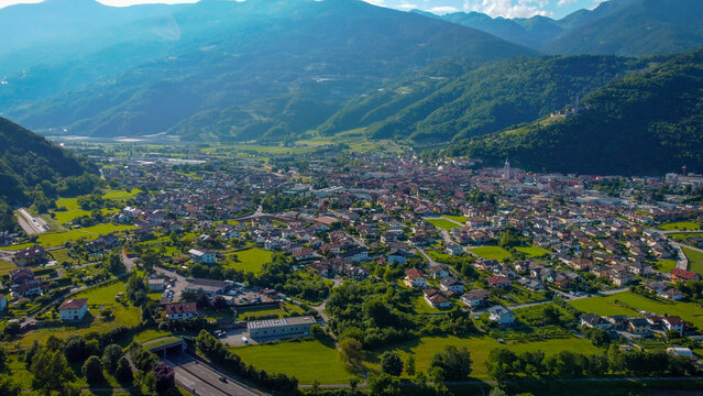 Aerial view of the town of Borgo Valsugana amidst the greenery of the mountains. Wonderful valley in Trentino, Italy