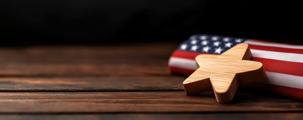 Obraz premium Wooden star with American flag on wooden background.