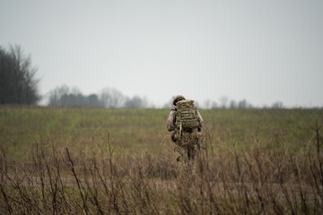 a soldier on a tabbing exercise bearing full 40Kg bergen