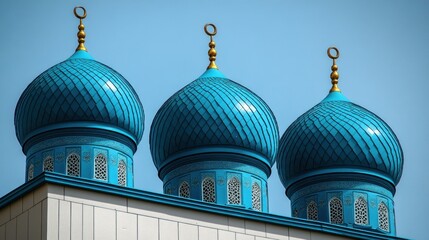Majestic Blue Domes of a Mosque under a Clear Sky