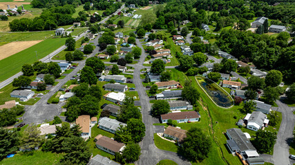Aerial view of a tranquil rural community featuring various Mobile, Prefab, Manufactured houses...