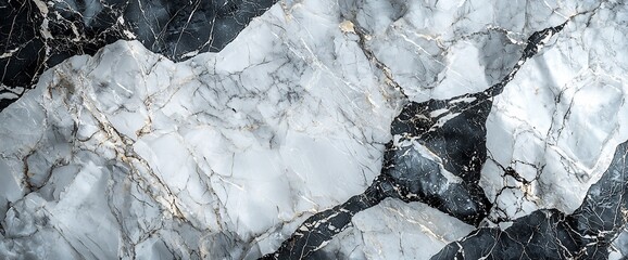 Abstract grey and white marble texture with gold veins.