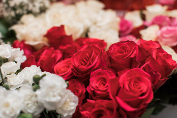 Beautiful bright pink and white roses with carnations 