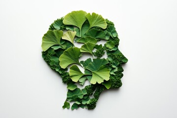 This artistic representation features a human head silhouette formed entirely from lush green leaves, symbolizing the harmony between nature and human thought.