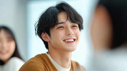 Smiling young man with friends indoor