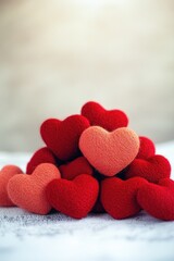 Fototapeta premium A collection of colorful hearts arranged on a surface, perfect for romantic occasions or Valentine's Day themes