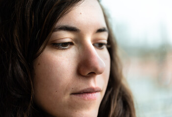 Fototapeta premium Indoor ortrait headshot of an attractive 27 yo white woman with brown hair