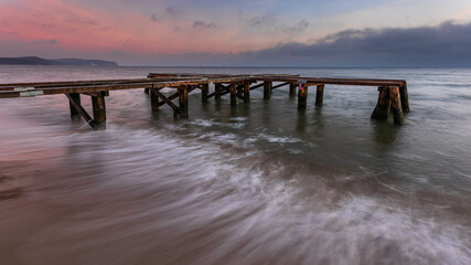 Early morning at frozen small pier in Sopot. Poland.