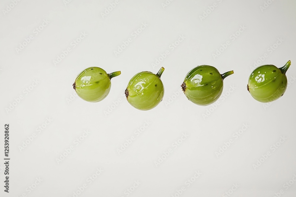 Poster a selection of green fruits arranged on a white background, suitable for use in food or nature-relat