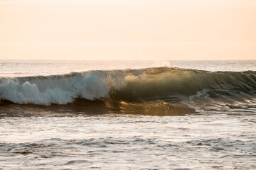 water flowing into the sun wave ocean sunset golden hour surf