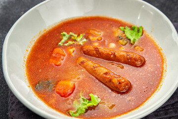 Tomato soup with sausages fresh tasty food dish delicious gourmet food background on the table rustic food top view copy space