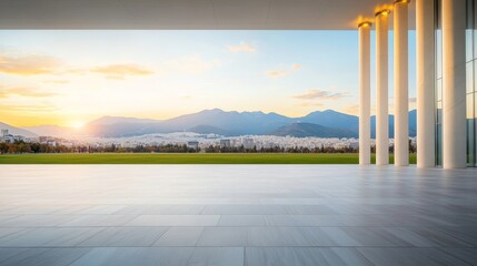 Breathtaking Sunset Over Mountain Landscape with Modern Architectural Structure and Expansive Open Space Featuring Pillars and Scenic Views