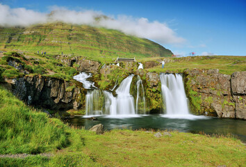 Waterfalls and mountains in the beautiful Icelandic landscape
