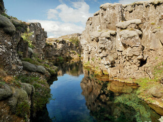 Lagoon with crystal clear water in a crack in the earth's crust in Iceland