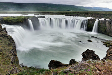 Waterfall in volcanic landscape in Iceland