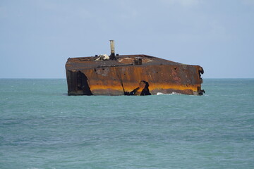 Fototapeta premium The shipwreck Mara Hope, an oil tanker, in the green ocean near Fortaleza Ceará, Brazil.