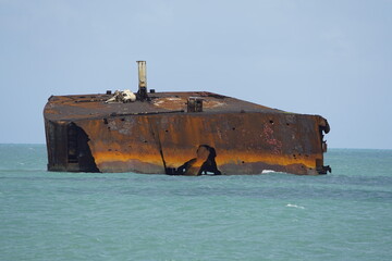 Fototapeta premium The shipwreck Mara Hope, an oil tanker, in the green ocean near Fortaleza Ceará, Brazil.