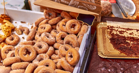 Homemade sweet donuts with powdered sugar at a fair