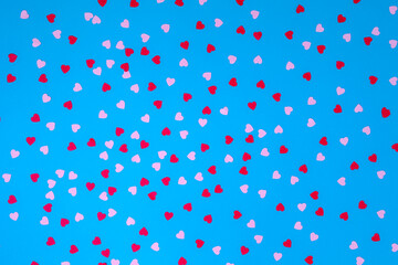 Blue background with many red and pink hearts