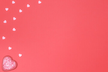 Valentine's Day. Red background with a heart-shaped cookie on the left side.