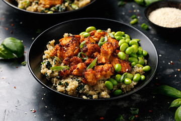 Sweet and sour tofu with spinach quinoa and steamed edamame beans. Healthy food.