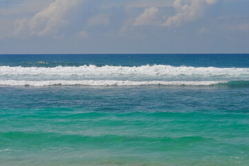Melasti Beach is beautiful with white sand and blue sea water