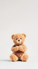 Obraz premium A cute teddy bear toy isolated on a white background 